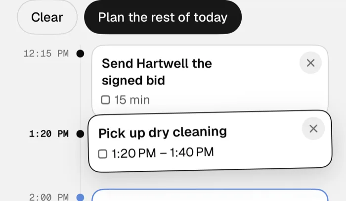 The Pick up dry cleaning block being dragged on the Day page, its label showing 1:20 PM to 1:40 PM.
